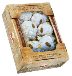 Delicate shortbread cookies are decorated with coconut flakes and honey syrup with the addition of white chocolate and almonds.